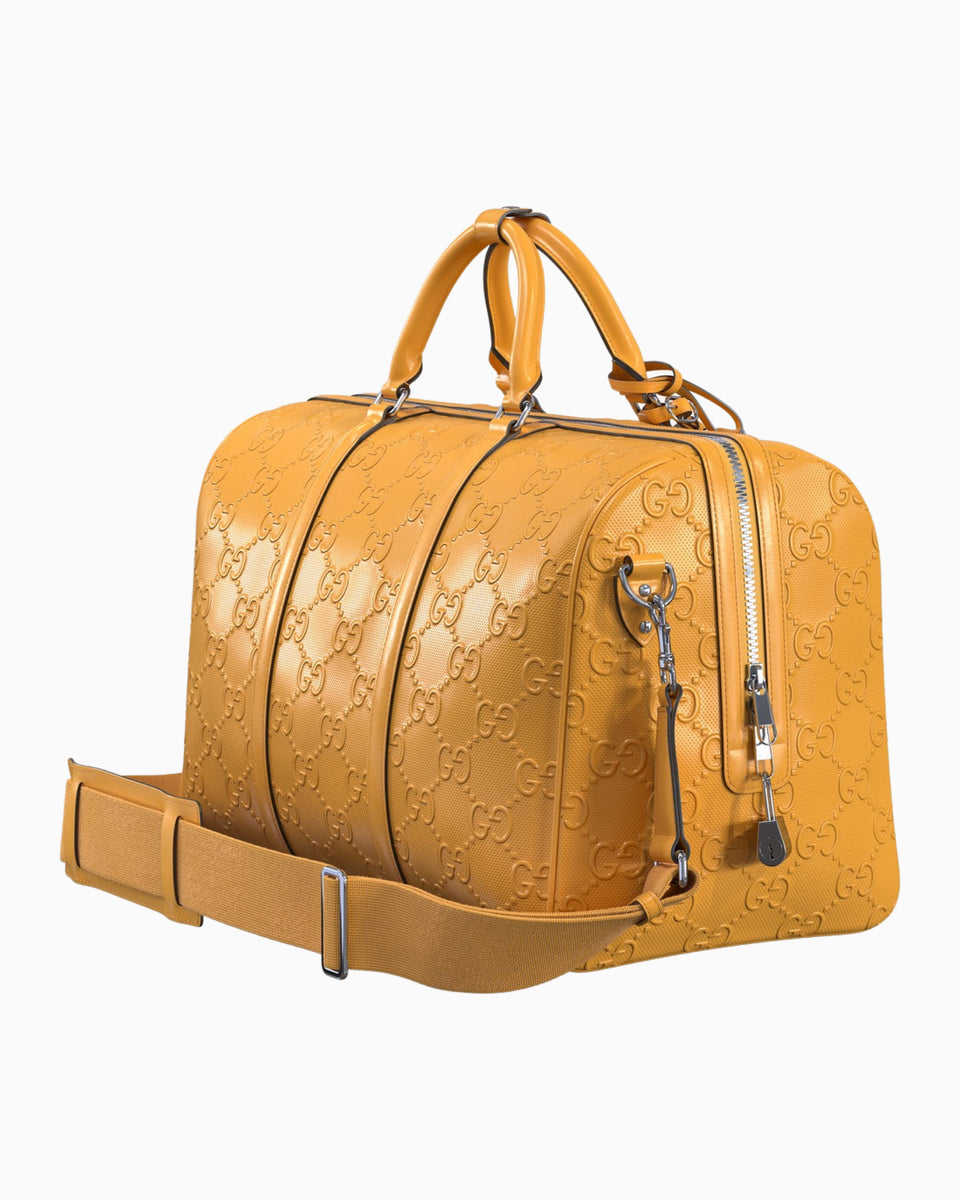 embossed leather duffle bag